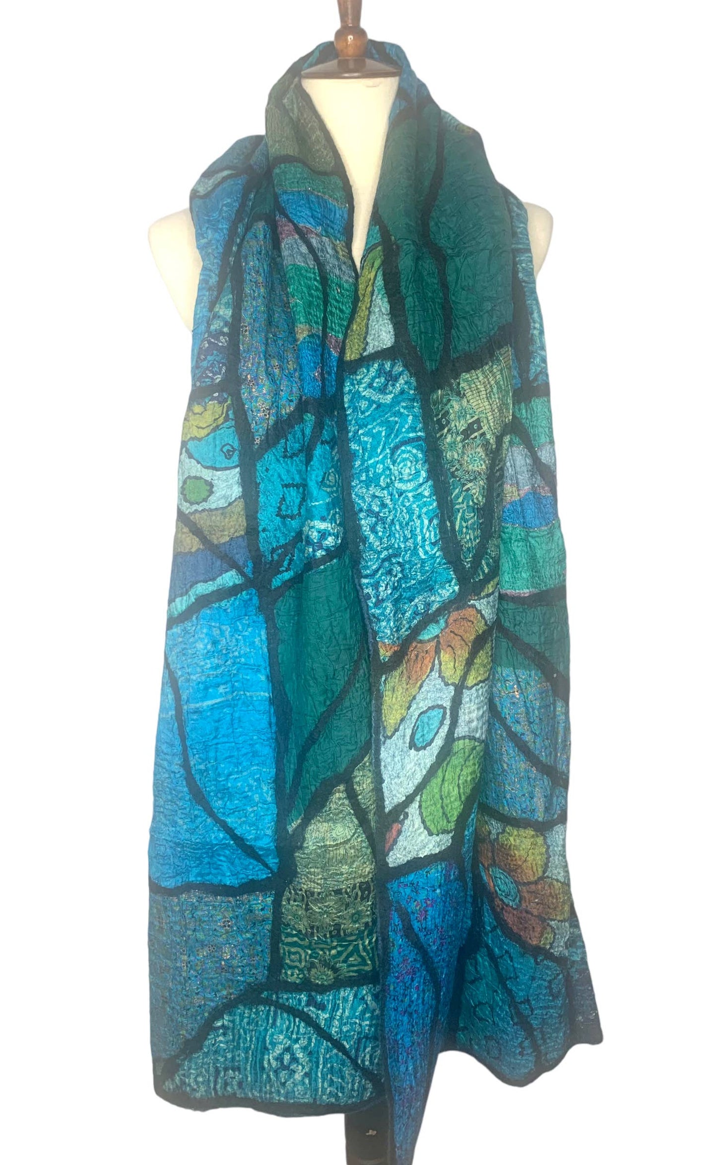Colorful scarf on a mannequin against a white background