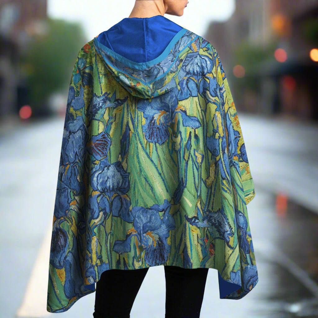 Blue floral iris patterned cape worn by a person