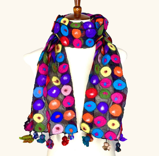 Colorful floral patterned scarf on a mannequin against a white background, front view