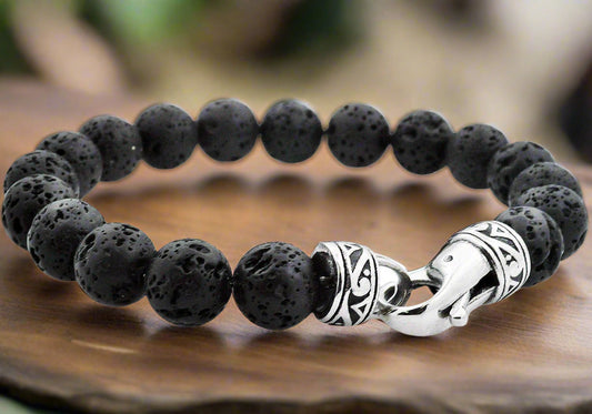 Men's Lava Stone Bracelet featuring natural black volcanic beads with stainless steel accents on elastic band